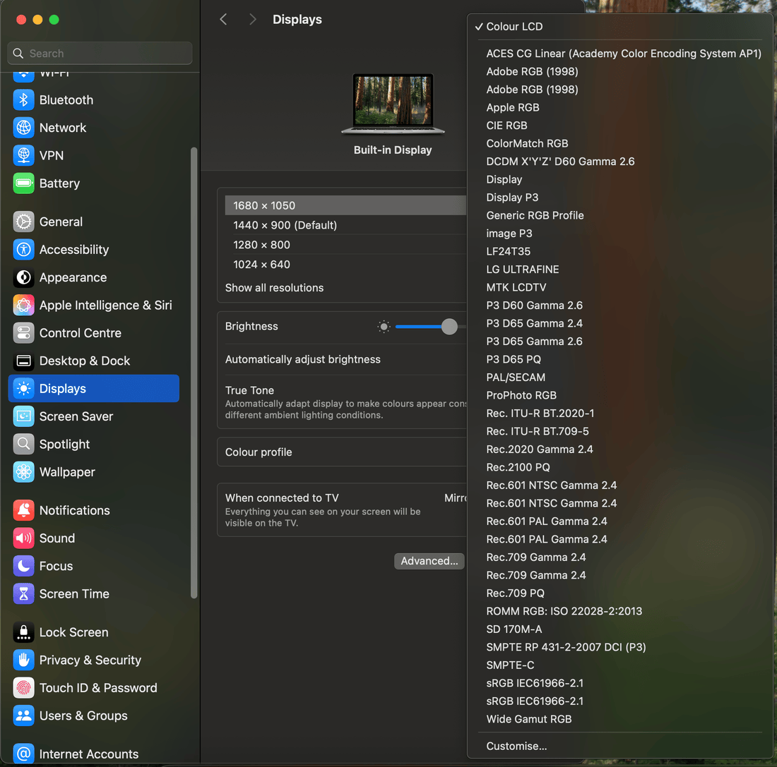 macOS System Settings Displays panel with the Color Profile menu open, showing the list of color profiles and the Customize option